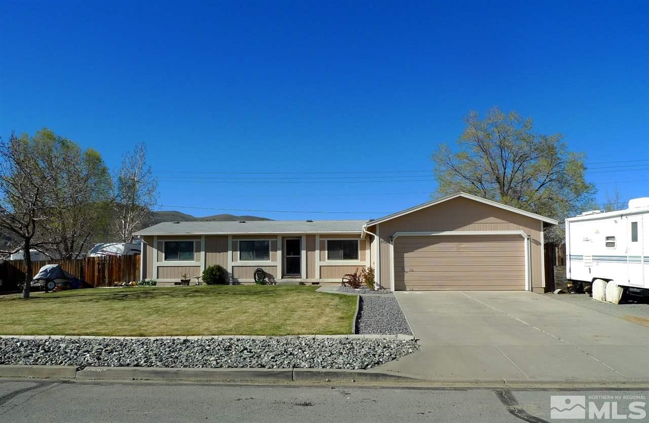 17315 Sunbird Lane Reno, NV 89508 - Photo 1 of 1 a front view of a house with a garden
