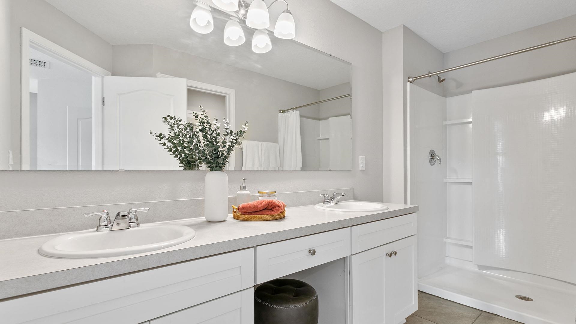 284 Redbud Road Palm Coast, FL 32137 - Photo 15 of 33 a bathroom with a sink double vanity granite and shower