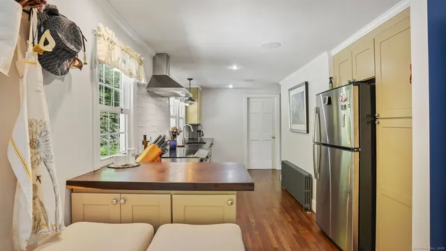 a kitchen with stainless steel appliances a refrigerator and a sink