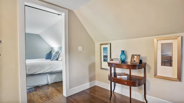 a view of a room that has a table and chair in it