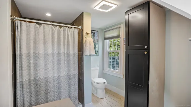 a view of house with backyard