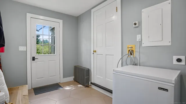 a view of storage and utility room with washer and dryer