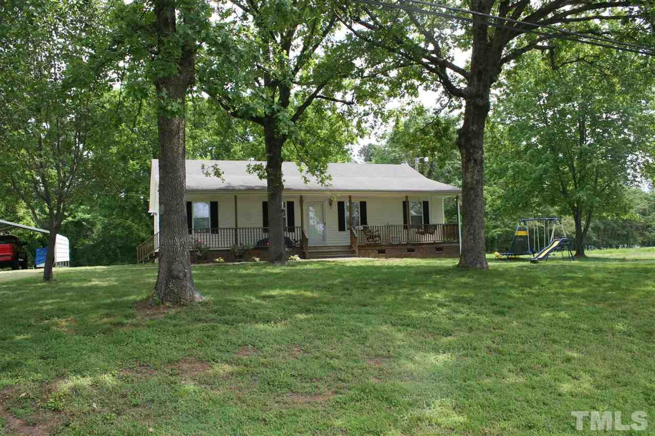 2817 Baptist Road Durham, NC 27703 - Photo 1 of 6 a front view of a house with a garden