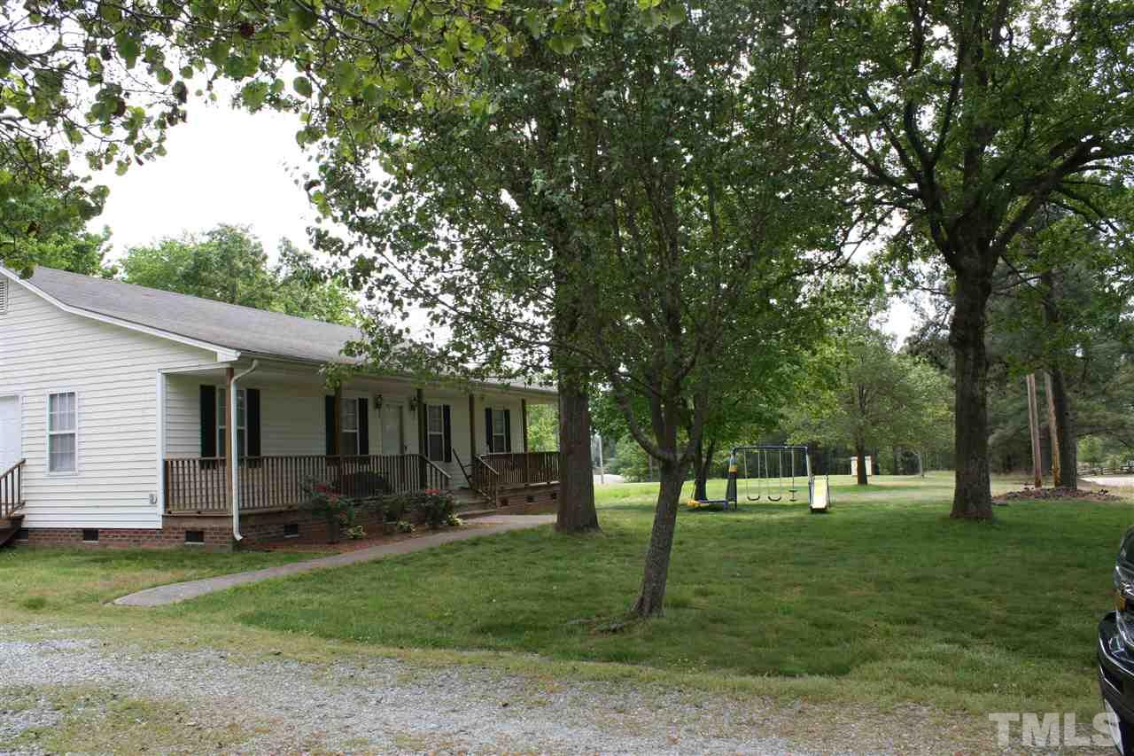 2817 Baptist Road Durham, NC 27703 - Photo 4 of 6 a front view of house with yard and green space