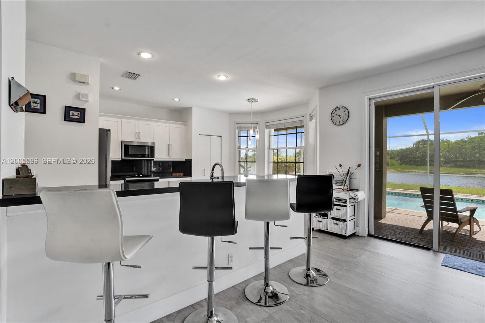 4281 Laurel Ridge Circle Weston, FL 33331 - Photo 23 of 80 a living room with furniture and a flat screen tv