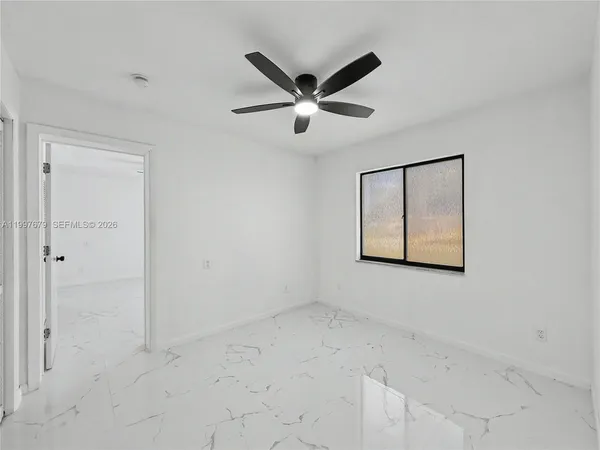 a view of a ceiling fan with a window