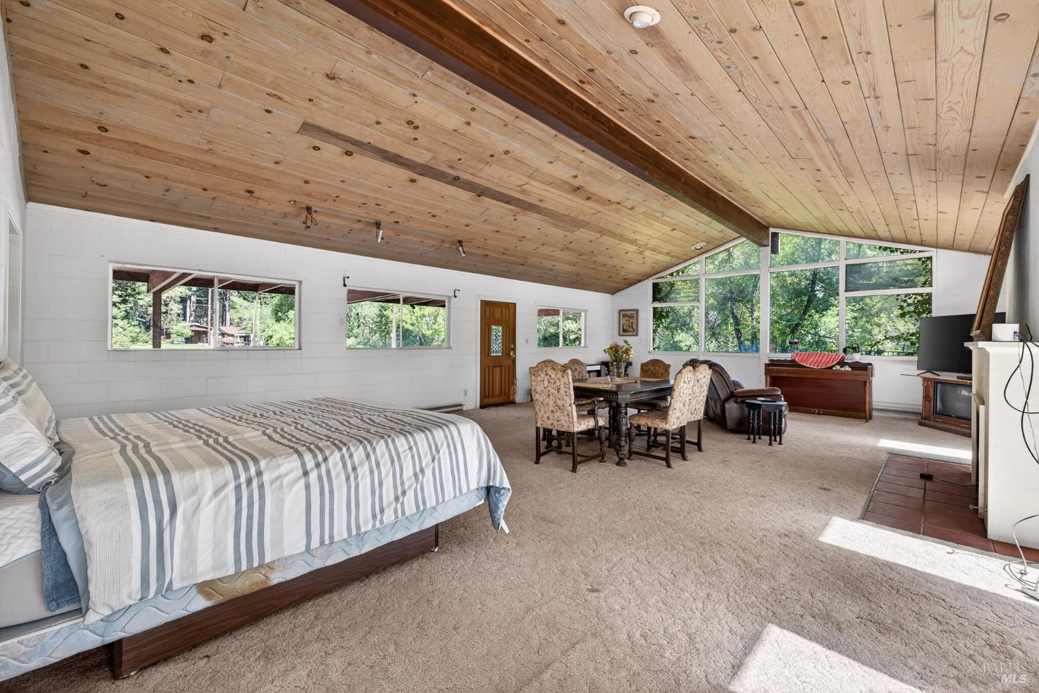 3320 Redwood Road Napa, CA 94558 - Photo 26 of 57 a bed room with furniture and a large window
