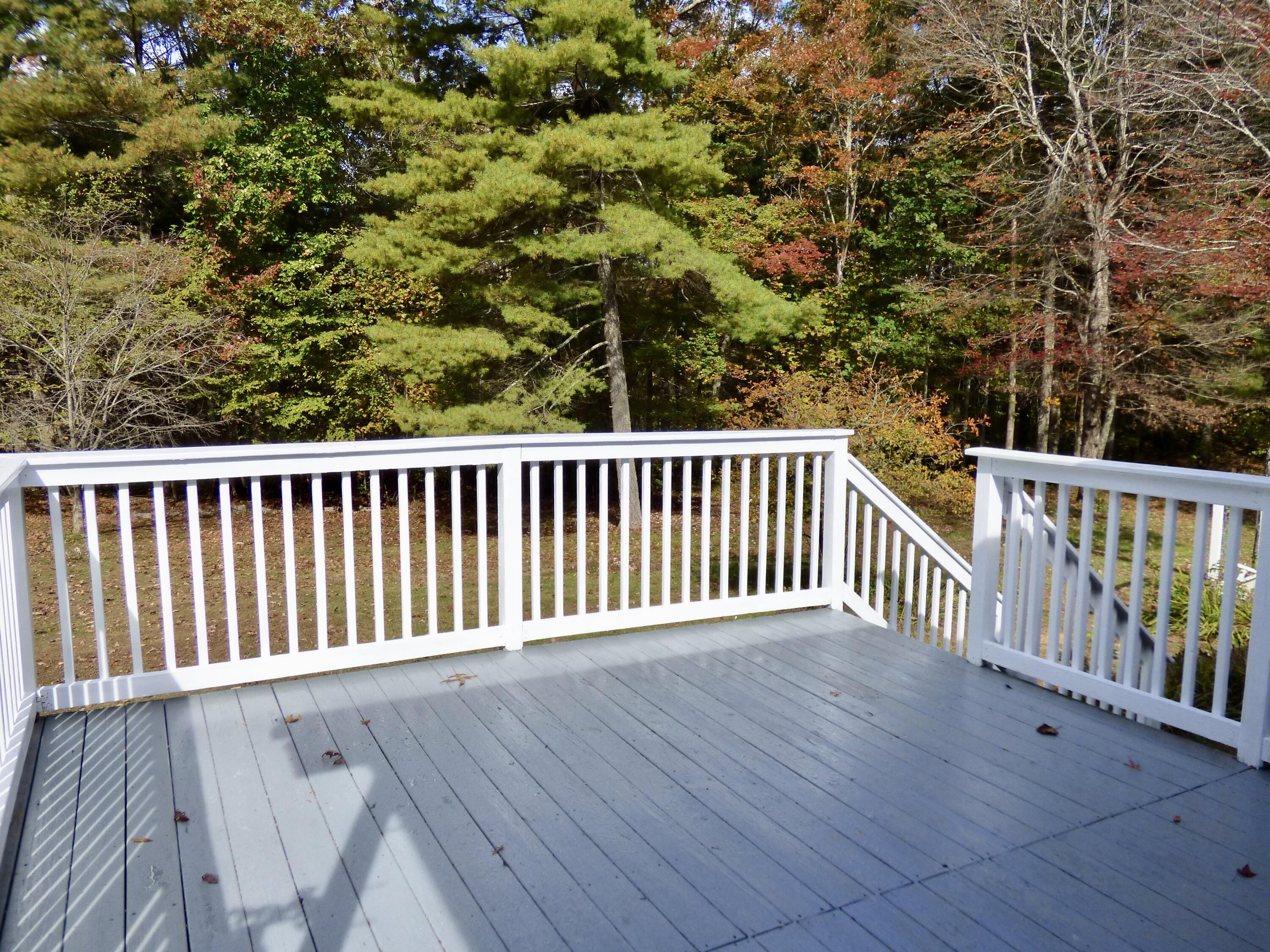 110 Little Cabin Road Northeast Floyd, VA 24091 - Photo 15 of 32 a balcony with wooden floor and trees
