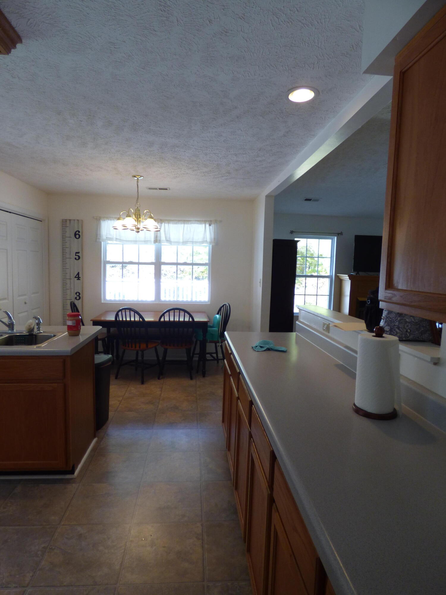 110 Little Cabin Road Northeast Floyd, VA 24091 - Photo 20 of 32 a kitchen with sink cabinets and window