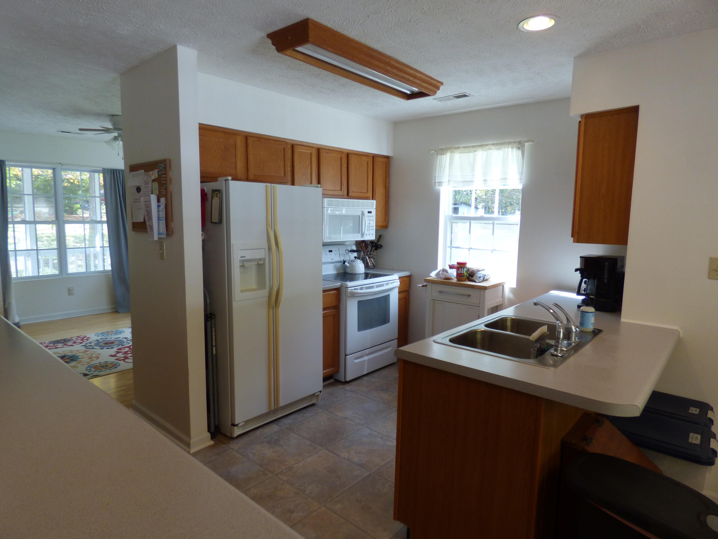 110 Little Cabin Road Northeast Floyd, VA 24091 - Photo 21 of 32 a kitchen that has a refrigerator and a sink
