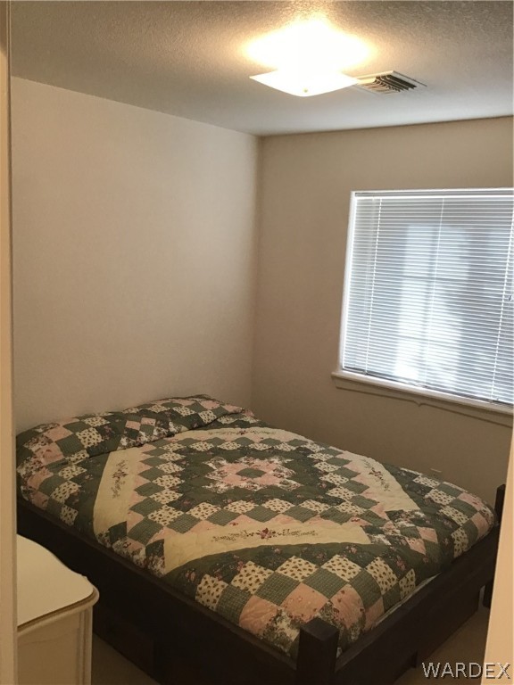 2204 Jamie Road Fort Mohave, AZ 86426 - Photo 12 of 22 a bedroom with a bed