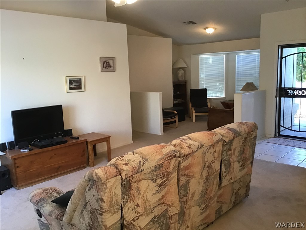 2204 Jamie Road Fort Mohave, AZ 86426 - Photo 8 of 22 a bedroom with a bed and wooden floor