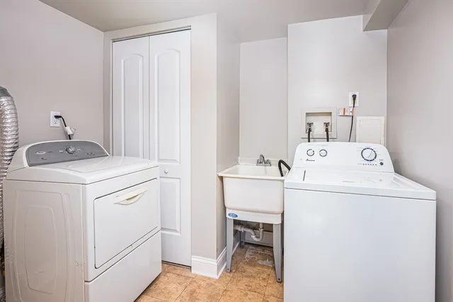 a utility room with dryer and washer