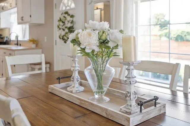 a vase of flowers sitting on a table