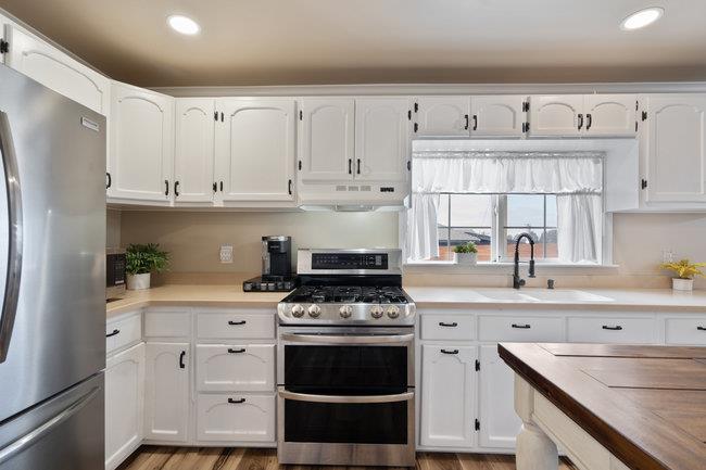 22 Heiner Road Watsonville, CA 95076 - Photo 17 of 51 a kitchen with cabinets appliances a sink and a counter top