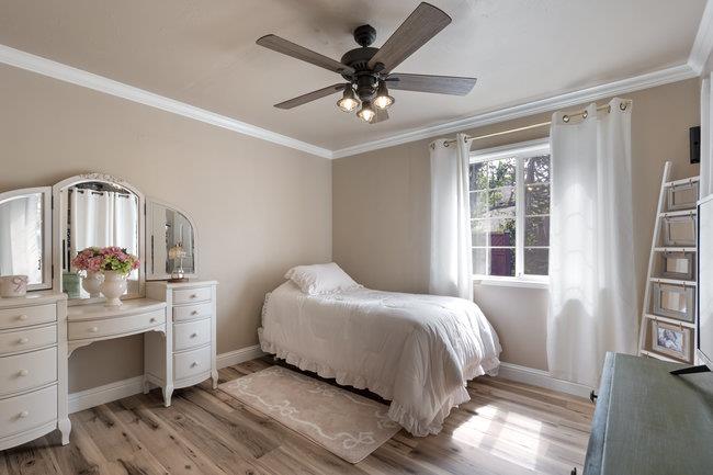 22 Heiner Road Watsonville, CA 95076 - Photo 23 of 51 a bedroom with a bed and a chandelier