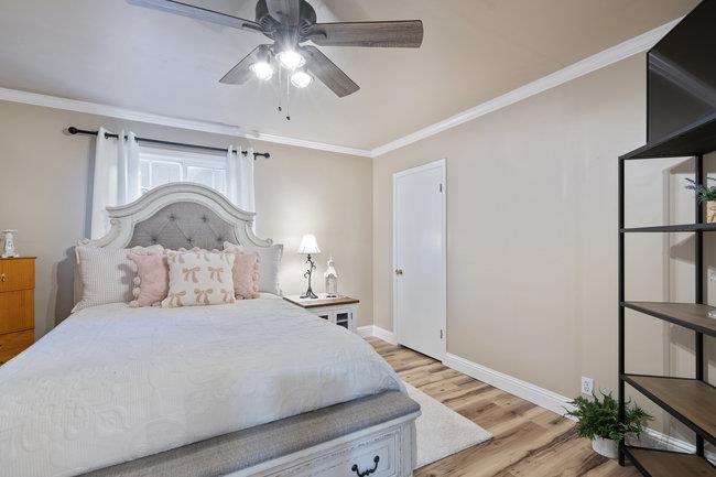 22 Heiner Road Watsonville, CA 95076 - Photo 24 of 51 a bedroom with a bed and a chandelier