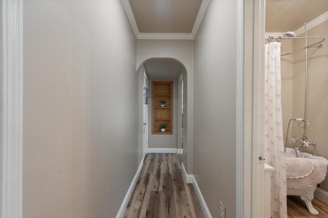 22 Heiner Road Watsonville, CA 95076 - Photo 27 of 51 a view of a hallway with wooden floor and a bathroom
