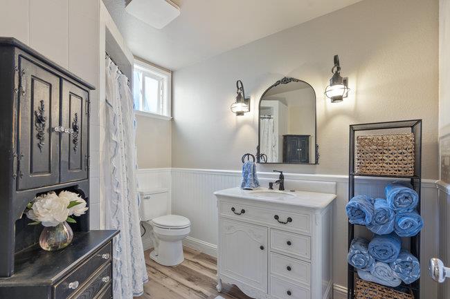 22 Heiner Road Watsonville, CA 95076 - Photo 35 of 51 a bathroom with a toilet sink and mirror