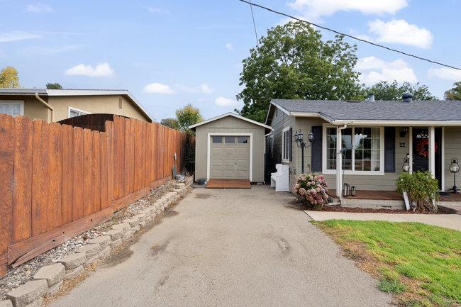 22 Heiner Road Watsonville, CA 95076 - Photo 5 of 51 a front view of a house with a garden and porch