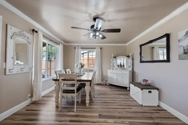 a dining room with furniture and window