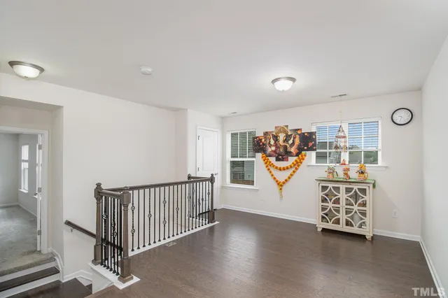 a view of an entryway with wooden floor