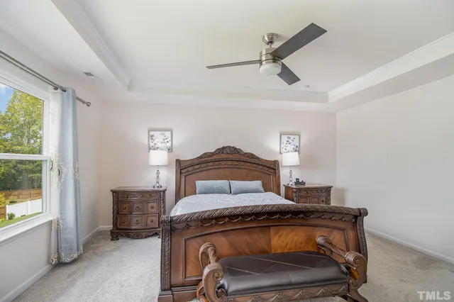 a view of bedroom with furniture and a window