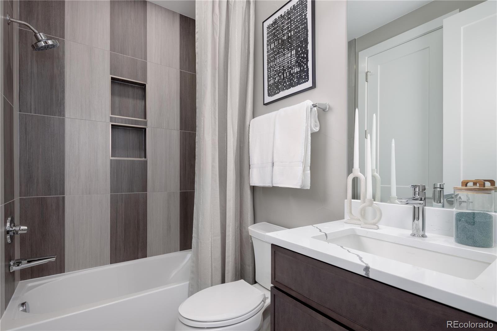 77 High Grove Loop Winter Park, CO 80482 - Photo 12 of 14 a bathroom with a granite countertop sink toilet and shower