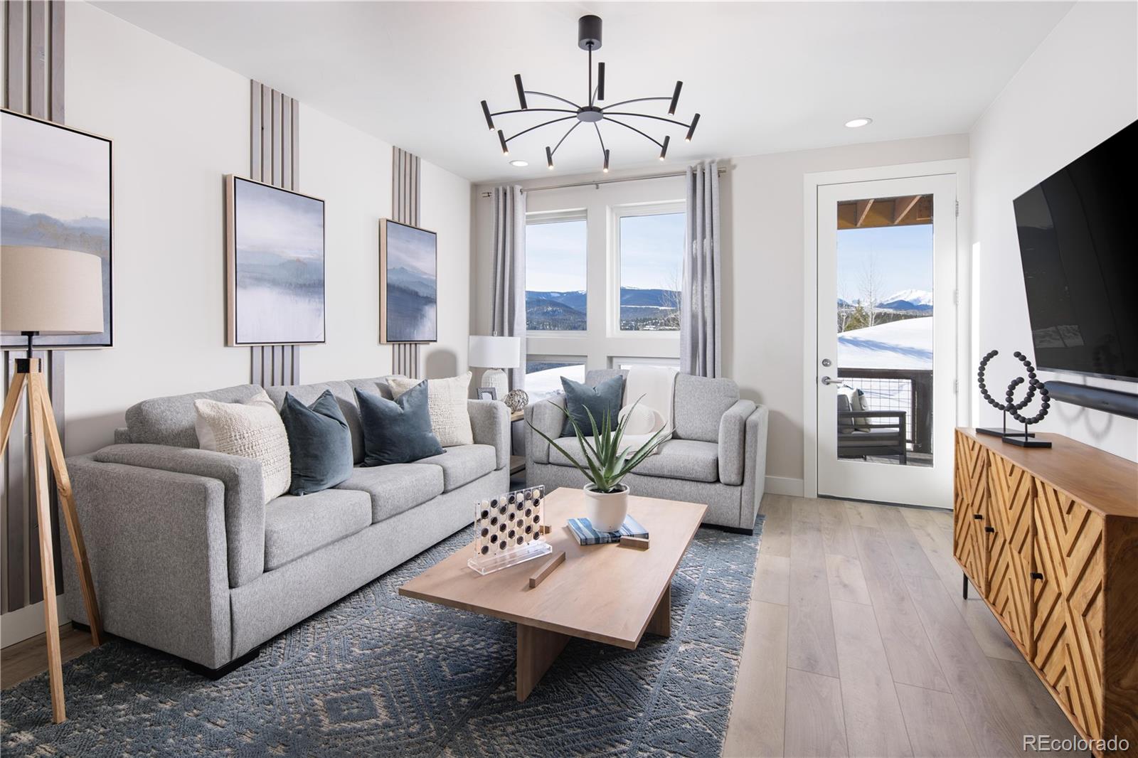 77 High Grove Loop Winter Park, CO 80482 - Photo 13 of 14 a living room with furniture a flat screen tv and a large window