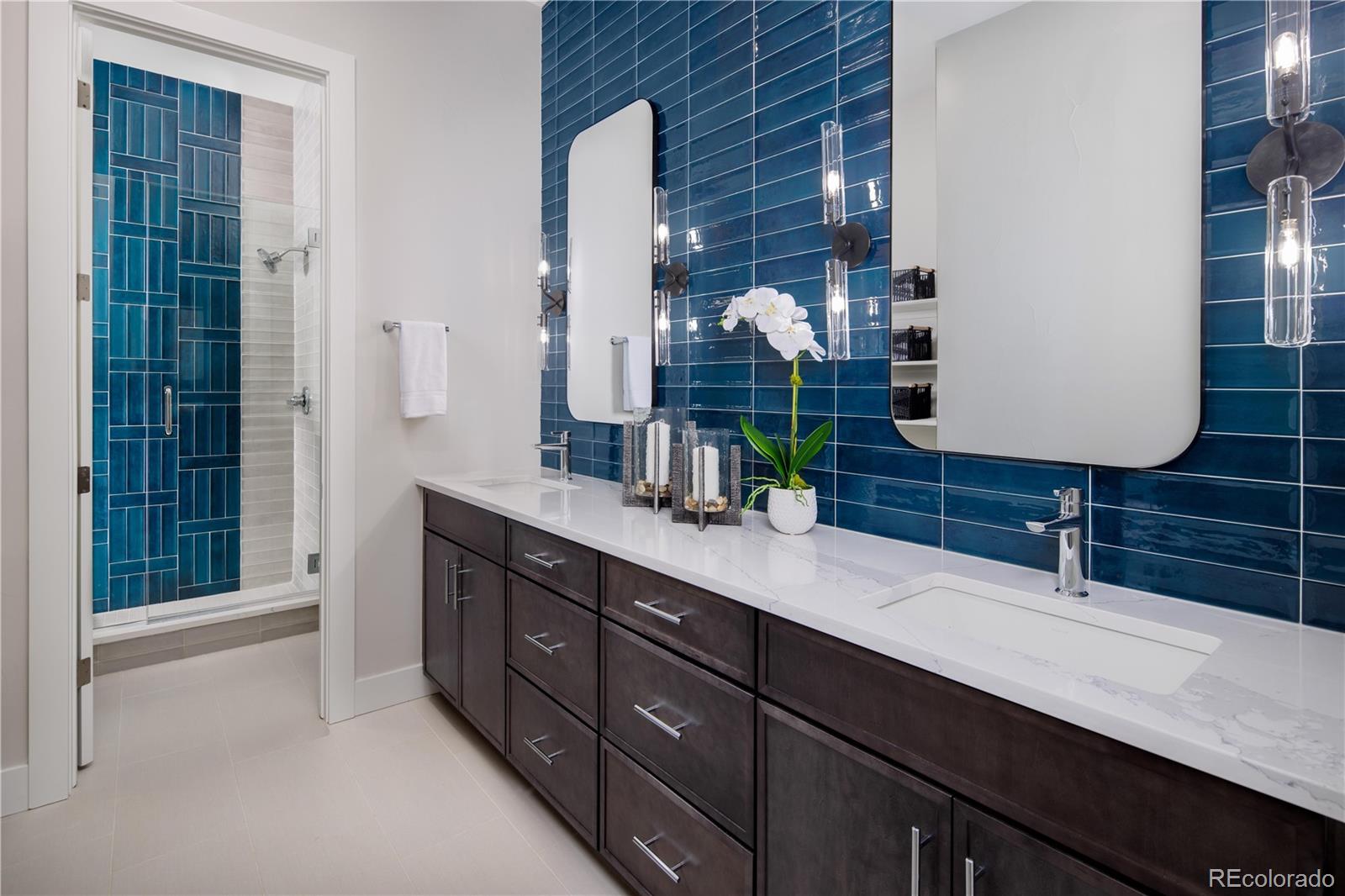 77 High Grove Loop Winter Park, CO 80482 - Photo 7 of 14 a bathroom with a double vanity sink and a mirror