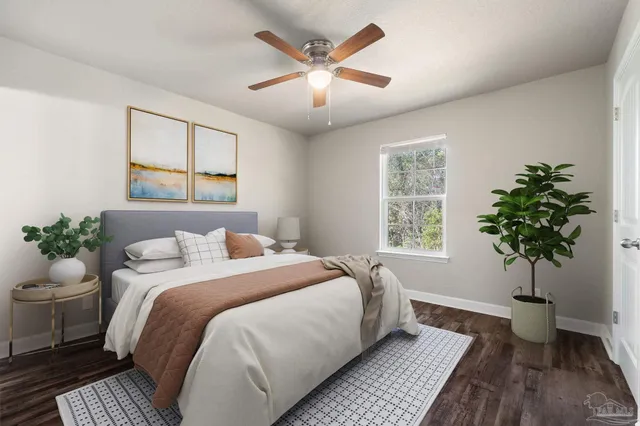 a bed sitting in a bedroom next to a window