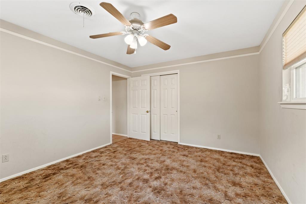 913 North Main Street Springtown, TX 76082 - Photo 25 of 40 a view of a big room with wooden floor and windows in a room