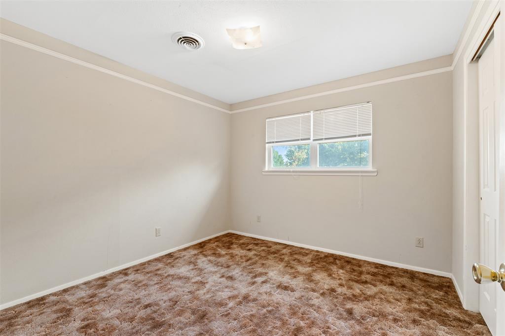 913 North Main Street Springtown, TX 76082 - Photo 26 of 40 an empty room with a window