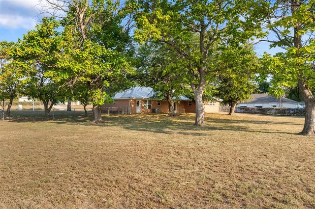 a house with trees in front of it
