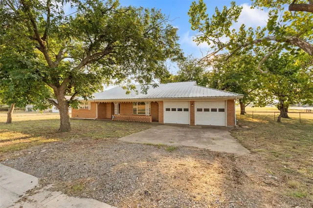 a house with trees in the background