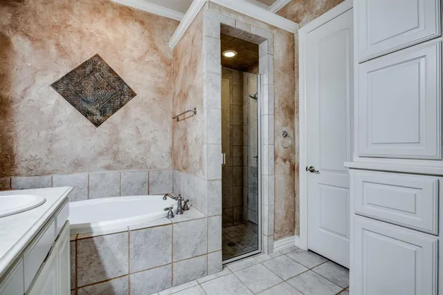 a bathroom with a bathtub and shower