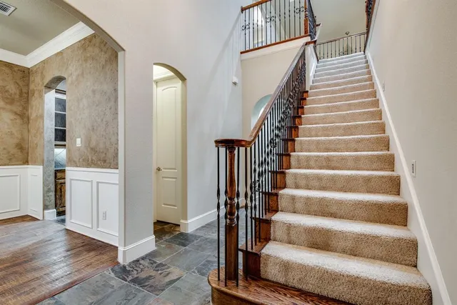 a view of staircase with white walls and windows
