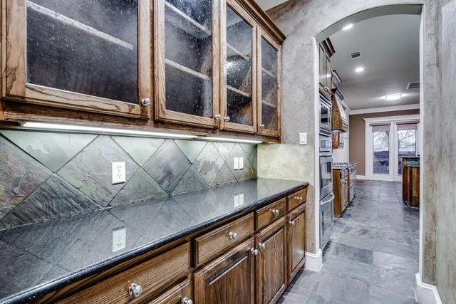 a kitchen with a sink and cabinets