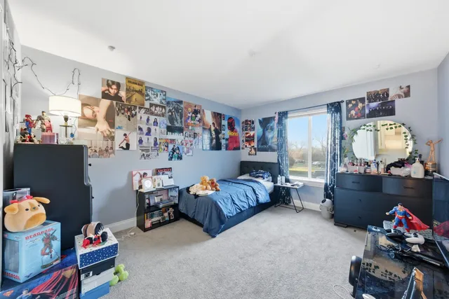 a bed room with furniture and a window