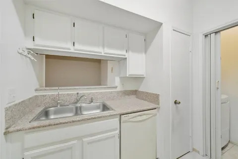 a kitchen with a stove and a microwave