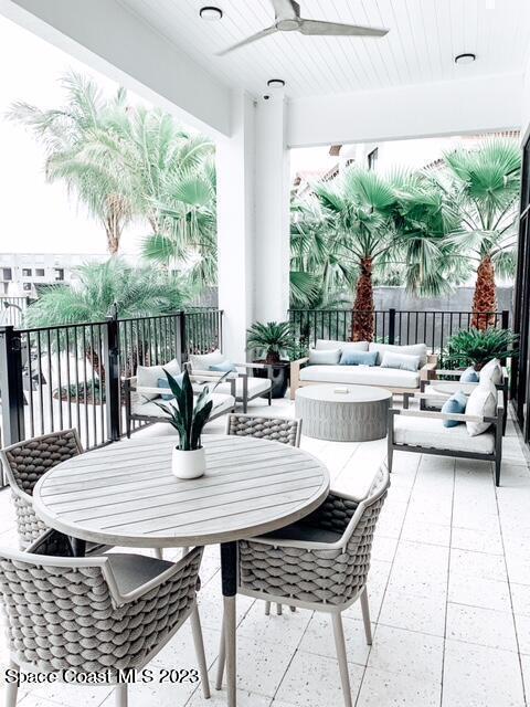 2755 Bosque Circle, Unit 302 Melbourne, FL 32940 - Photo 15 of 18 a view of a patio with table and chairs and potted plants