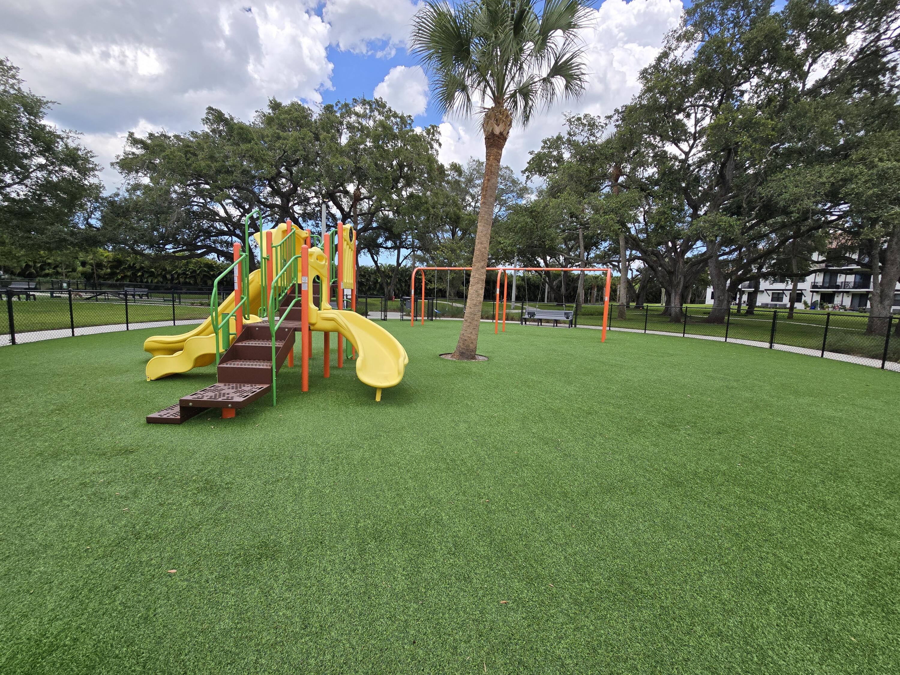 2755 Bosque Circle, Unit 302 Melbourne, FL 32940 - Photo 16 of 18 a view of a park with slide