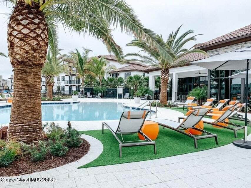 2755 Bosque Circle, Unit 302 Melbourne, FL 32940 - Photo 2 of 18 a view of outdoor space yard swimming pool and patio