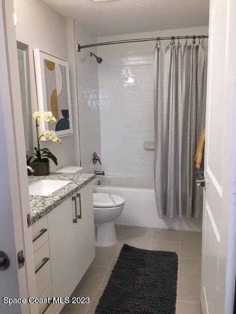 2755 Bosque Circle, Unit 302 Melbourne, FL 32940 - Photo 8 of 18 a bathroom with a granite countertop sink toilet and shower