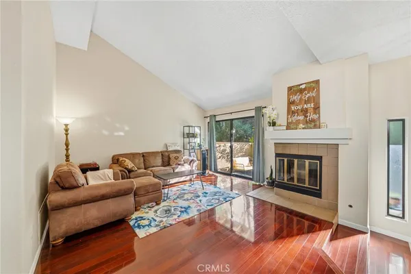 a living room with furniture and a fireplace