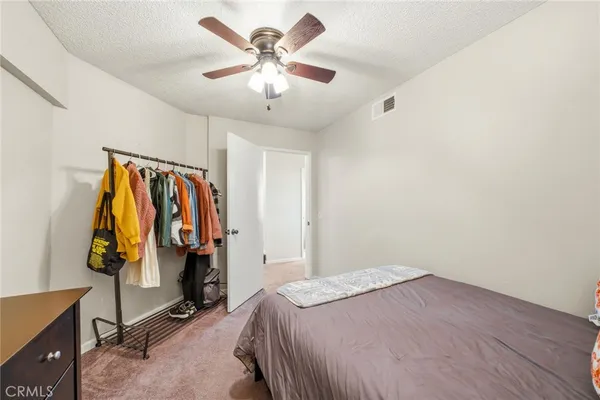 a bedroom with a bed and a walk in closet