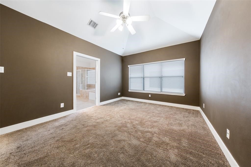 3027 Buttercup Street Houston, TX 77063 - Photo 17 of 29 an empty room with windows and ceiling fan