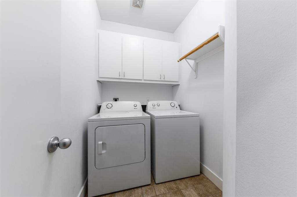 3027 Buttercup Street Houston, TX 77063 - Photo 22 of 29 a utility room with dryer and washer