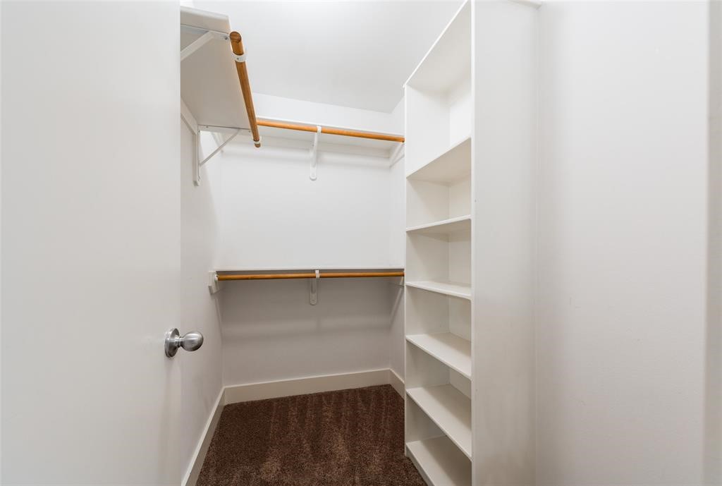 3027 Buttercup Street Houston, TX 77063 - Photo 25 of 29 a view of walk in closet with empty racks