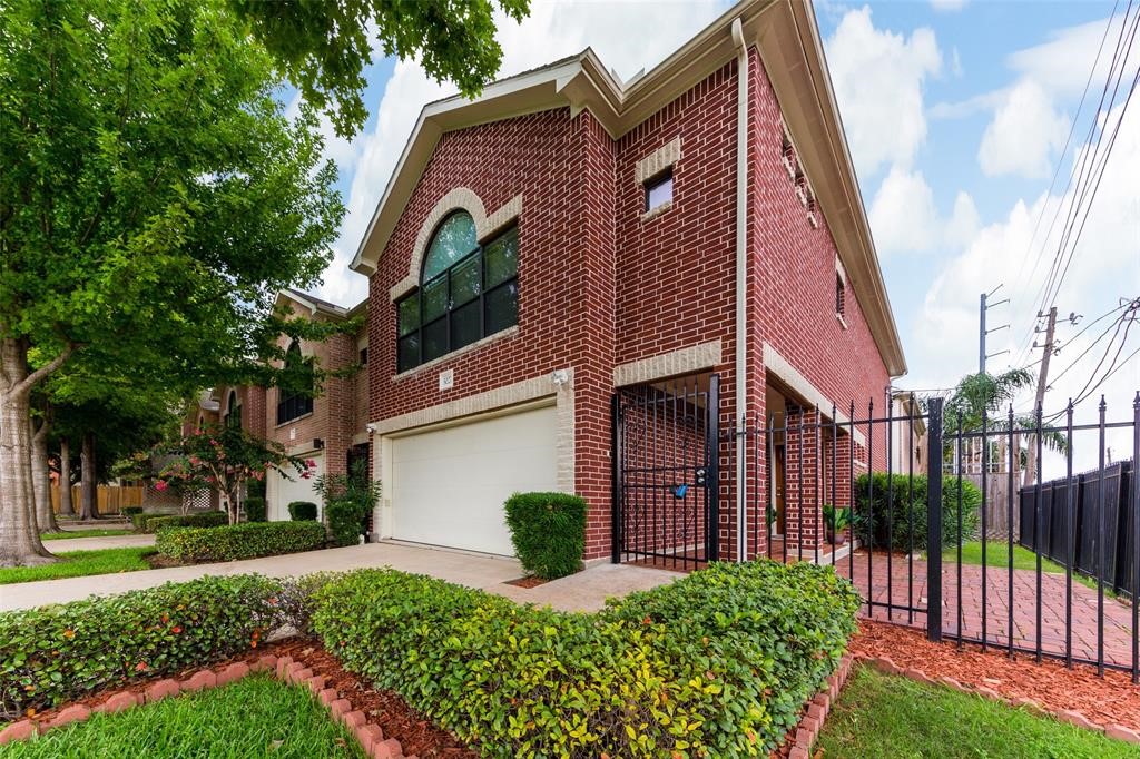 3027 Buttercup Street Houston, TX 77063 - Photo 29 of 29 a view of a house with a small yard plants and large tree